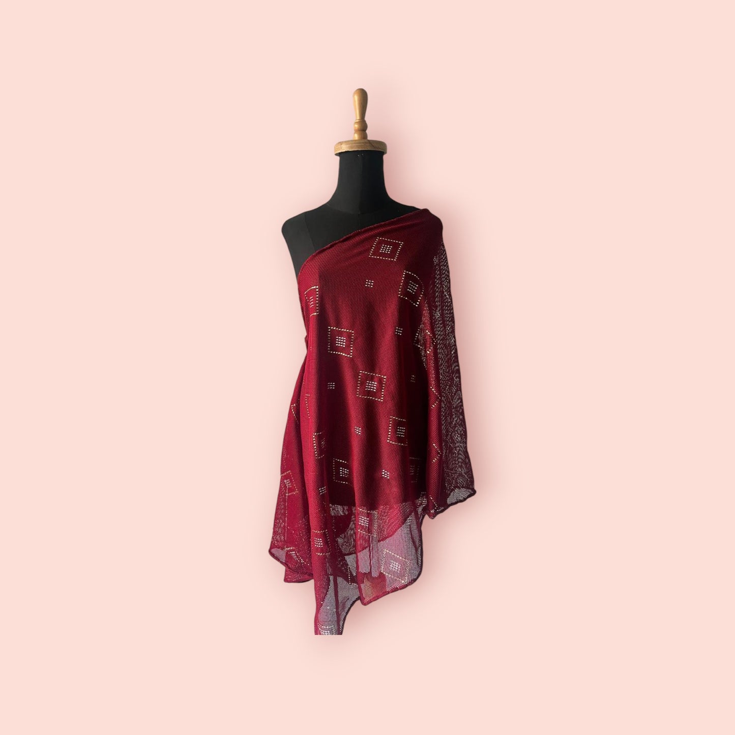 A red knitted tally shawl