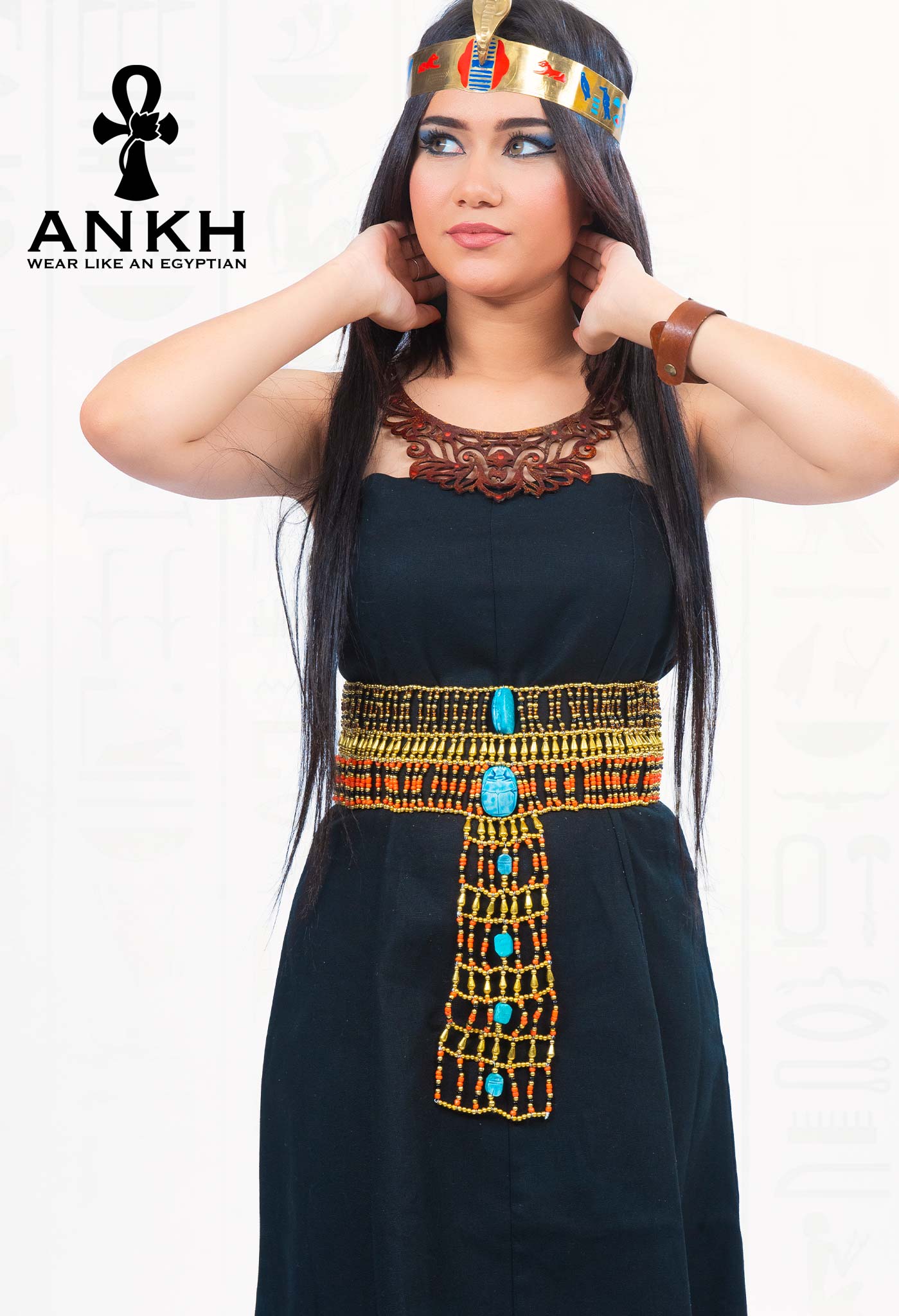 Woman wearing an elegant strapless linen dress adorned with an Ankh pendant necklace symbolizing life in ancient Egypt
