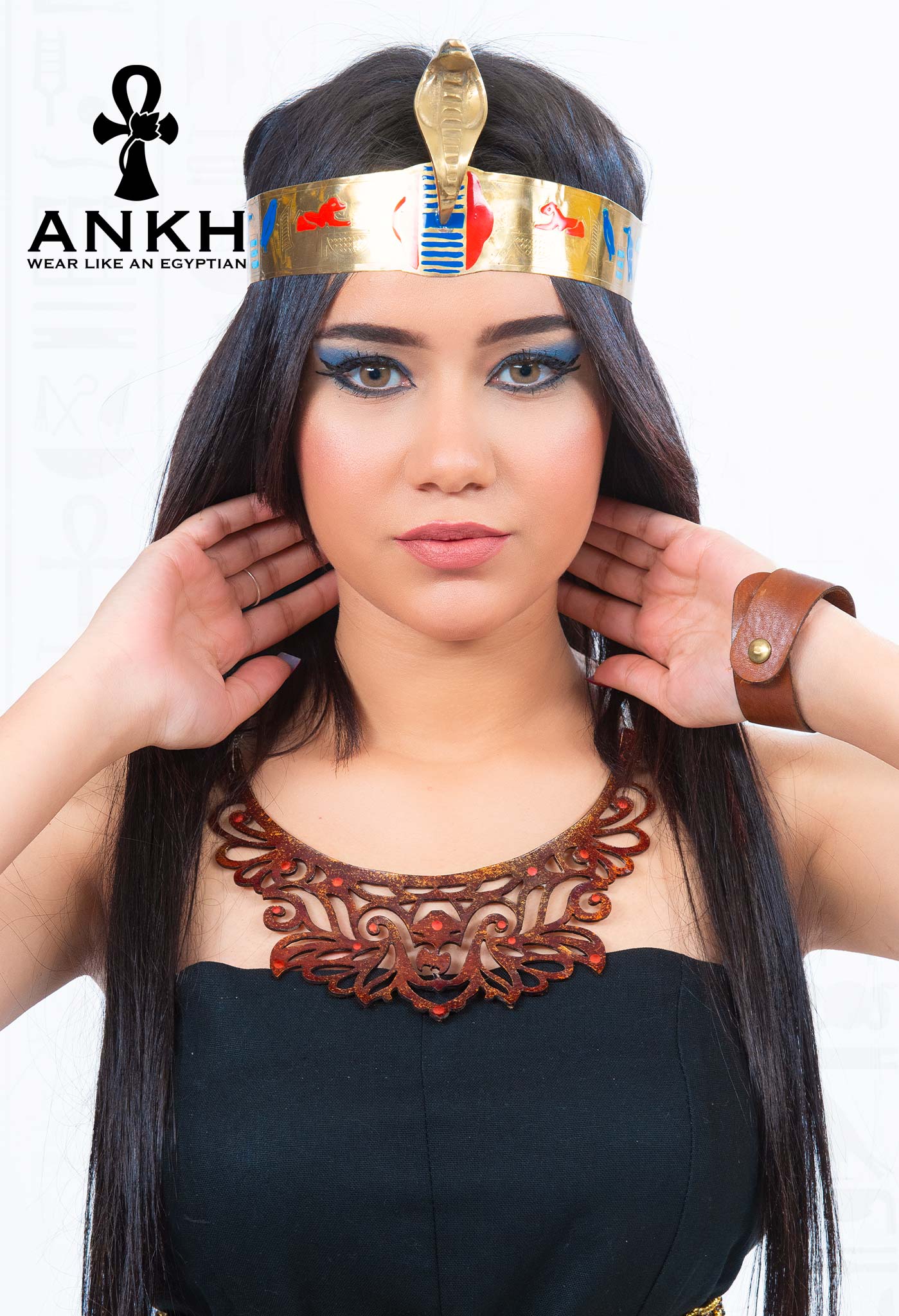 Woman wearing an elegant strapless linen dress adorned with an Ankh pendant necklace symbolizing life in ancient Egypt