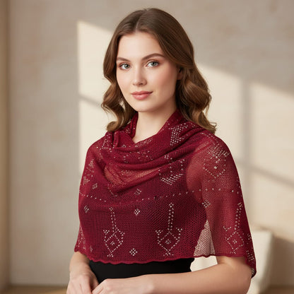 Woman wearing a red shawl with a subtle pattern against a neutral background
