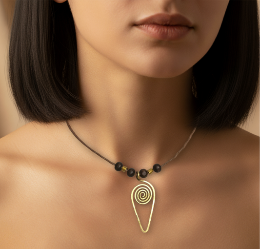 Necklace with a spiral pendant worn by a person