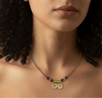 Necklace with a gold pendant on a model with dark hair