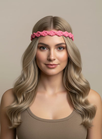 Woman wearing a pink headband against a beige background