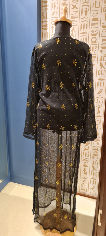 Elegant hand-embroidered black Gallabia adorned with golden Egyptian heritage designs; perfect for enthusiasts of Egypt’s rich culture and history.