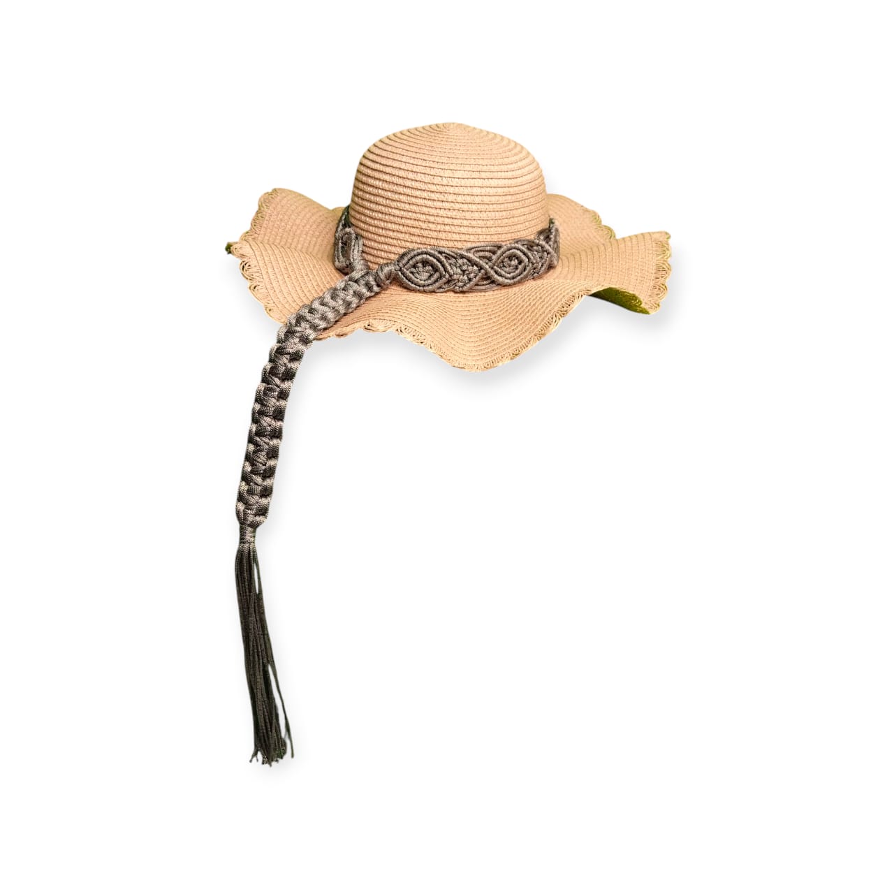 Beige straw hat with decorative band and tassel on a white background