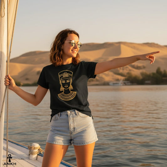 Woman on a boat pointing towards a scenic landscape with mountains and water.