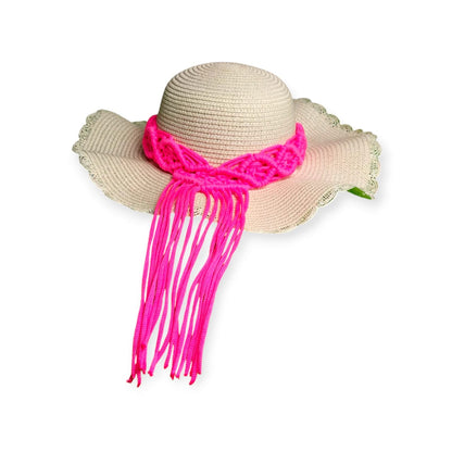 Beige straw hat with a pink scarf on a white background