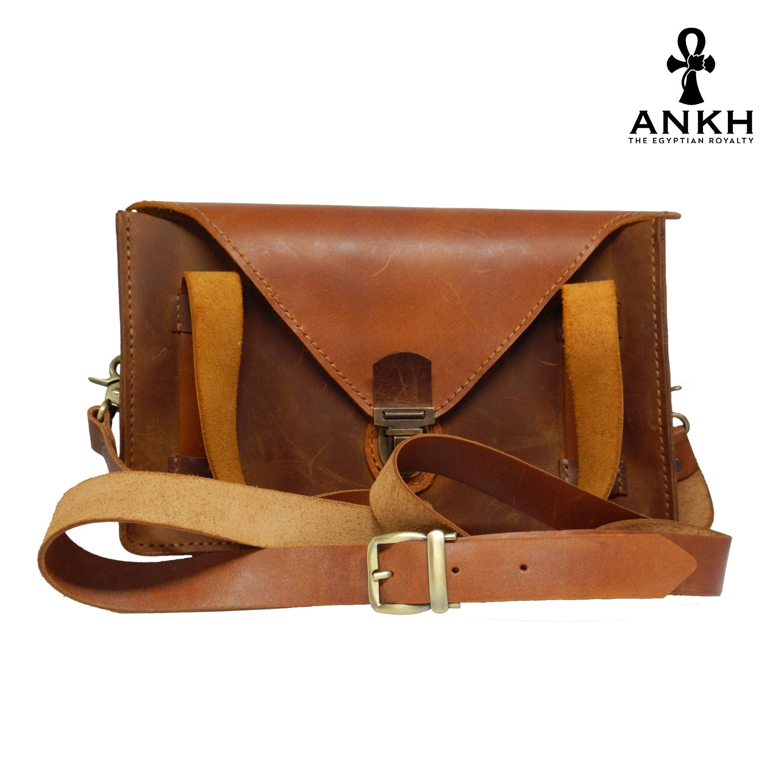 A genuine leather cross bag with handcrafted brass accessories and multiple pockets, displayed on a white background with a black logo of ANKH - The Egyptian Royalty.