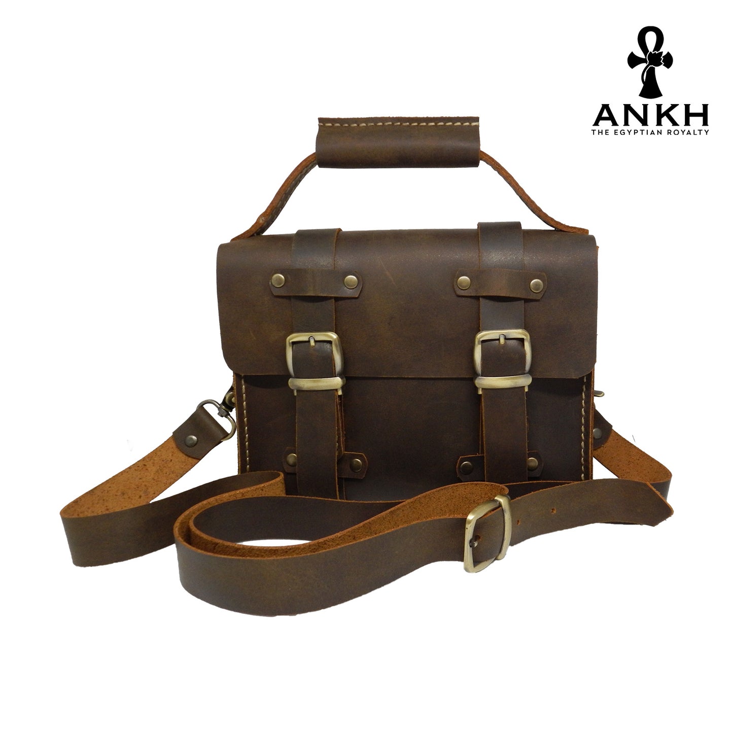 A genuine leather cross bag with handcrafted brass accessories and multiple pockets, displayed on a white background with a black logo of ANKH - The Egyptian Royalty.