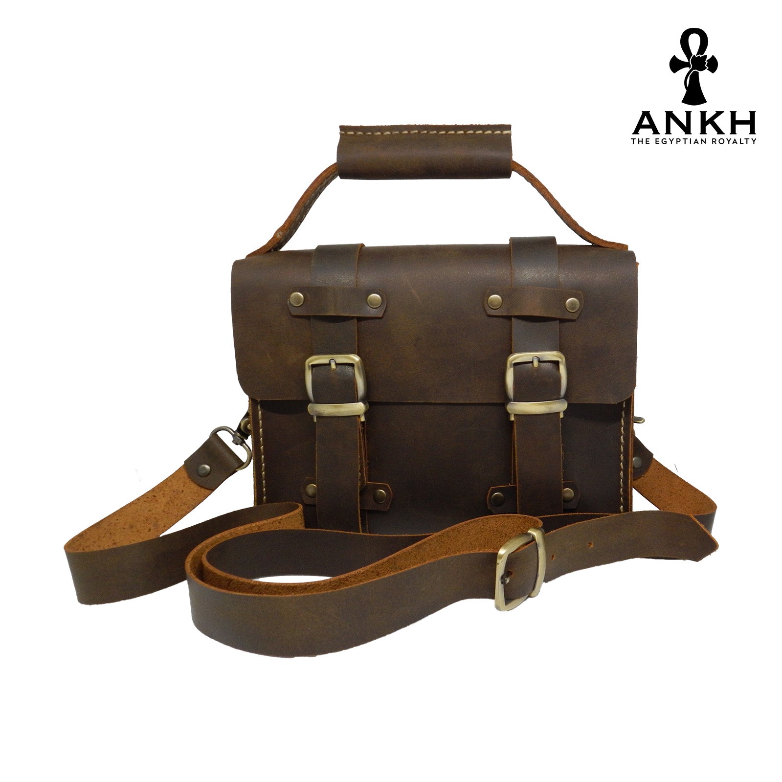 A genuine leather cross bag with handcrafted brass accessories and multiple pockets, displayed on a white background with a black logo of ANKH - The Egyptian Royalty.