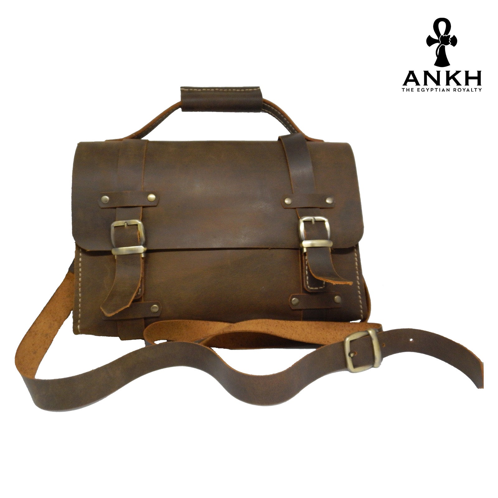 A genuine leather cross bag with handcrafted brass accessories and multiple pockets, displayed on a white background with a black logo of ANKH - The Egyptian Royalty.