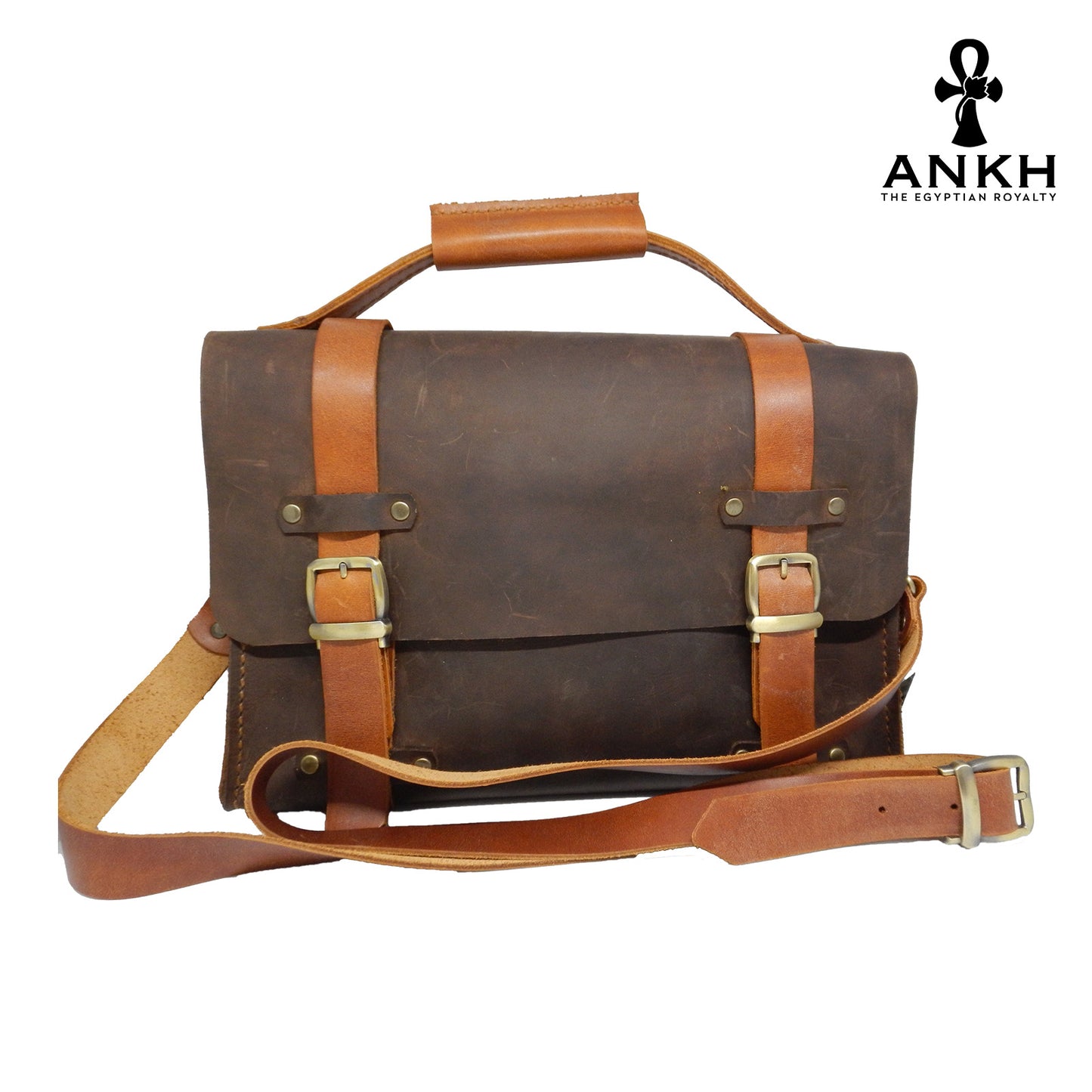 A genuine leather cross bag with handcrafted brass accessories and multiple pockets, displayed on a white background with a black logo of ANKH - The Egyptian Royalty.