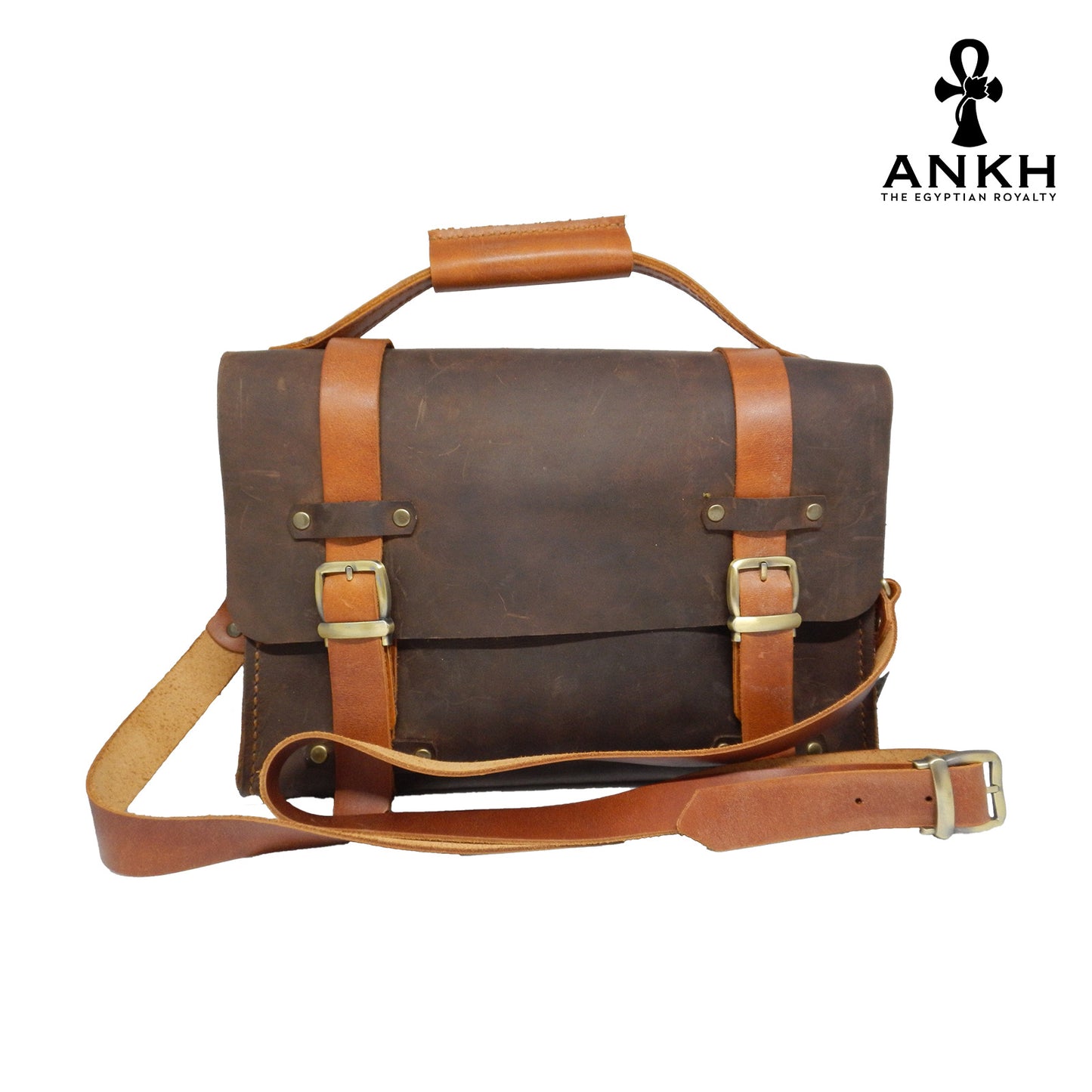 A genuine leather cross bag with handcrafted brass accessories and multiple pockets, displayed on a white background with a black logo of ANKH - The Egyptian Royalty.