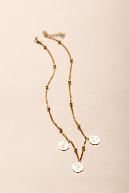 Gold-Plated Egyptian Symbol Necklace with Lotus, Horus, and Maat Pendants