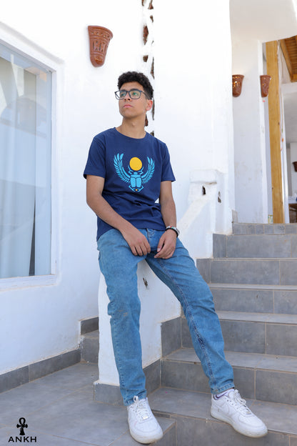 A man wearing a t-shirt with a printed Ancient Egyptian scarab symbol, made from soft 100% Egyptian cotton