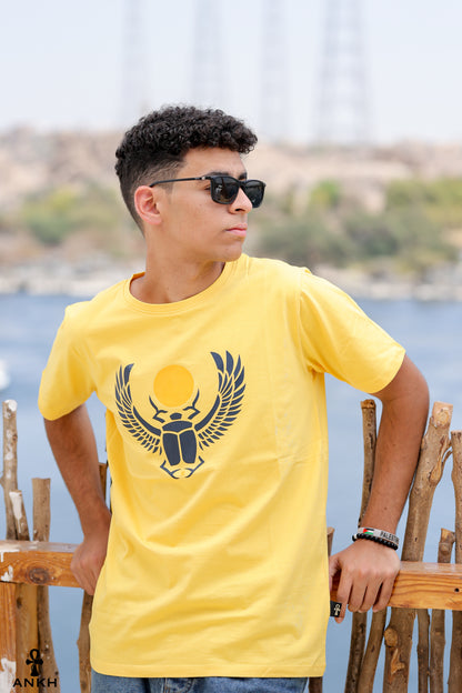 A man wearing a t-shirt with a printed Ancient Egyptian scarab symbol, made from soft 100% Egyptian cotton