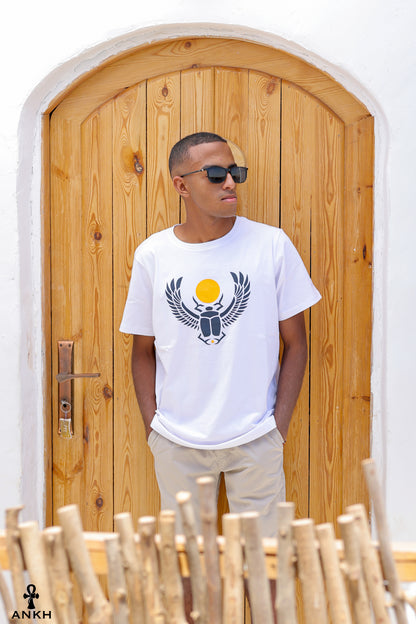 A man wearing a t-shirt with a printed Ancient Egyptian scarab symbol, made from soft 100% Egyptian cotton