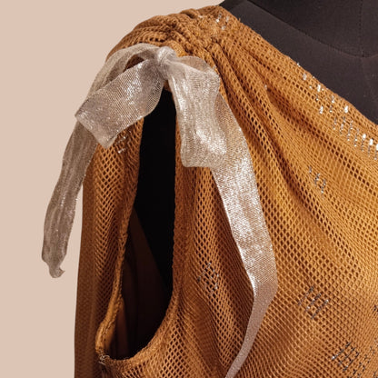Brown textured tally fabric with a silver ribbon on a beige background