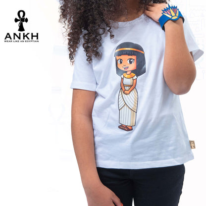 A child wearing Ankh’s white t-shirt adorned with ‘Anippe’, a cartoony Egyptian girl character printed on premium quality 100% Egyptian cotton - perfect attire reflecting ancient Egyptian culture