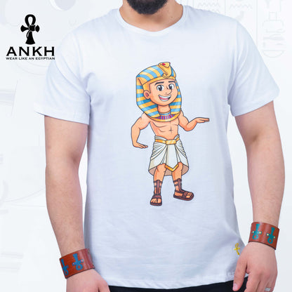 A man wearing an exclusive ‘Royal Tut’ T-shirt from Ankh featuring a playful cartoon depiction of King Tutankhamun printed on premium 100% Egyptian Cotton