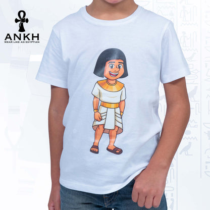 A child wearing a white T-shirt adorned with a playful illustration of Sinuhe, an iconic Egyptian boy character - an epitome of luxury and cultural richness